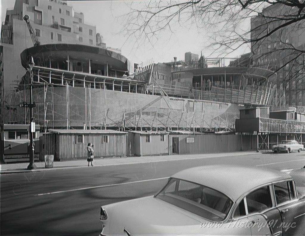 Photograph of cars parked across the street from the Guggenheim Museum.