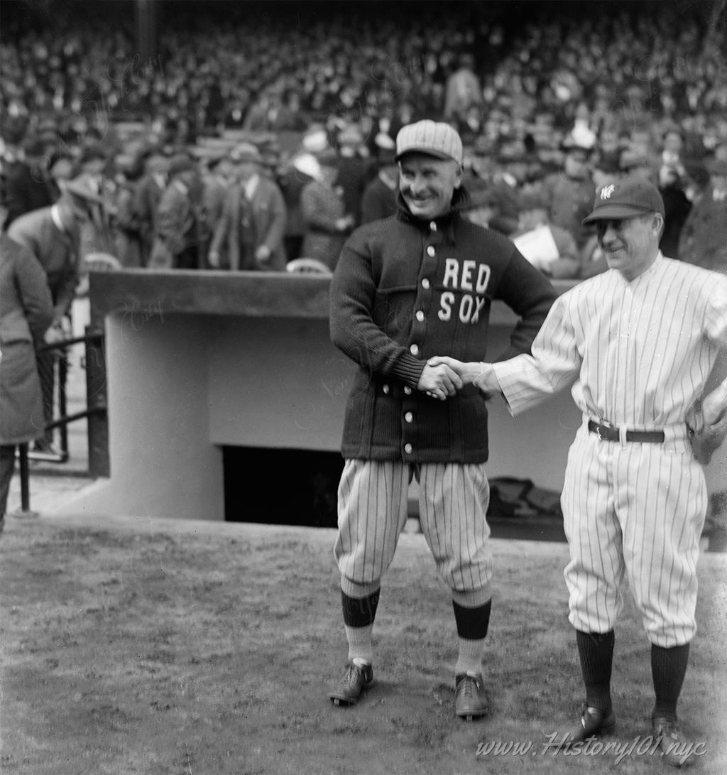 Frank Chance & Miller Huggins, managers of the Red Sox & Yankees shaking hands before the opening game at Yankee Stadium, kicking off decades of rivalry between NYC and Boston.