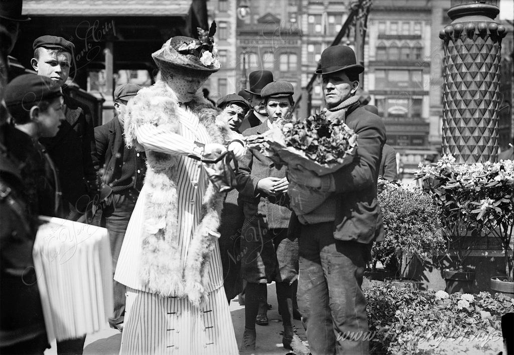 A woman buys flowers from a vendor in Union Square, surrounded by local children.