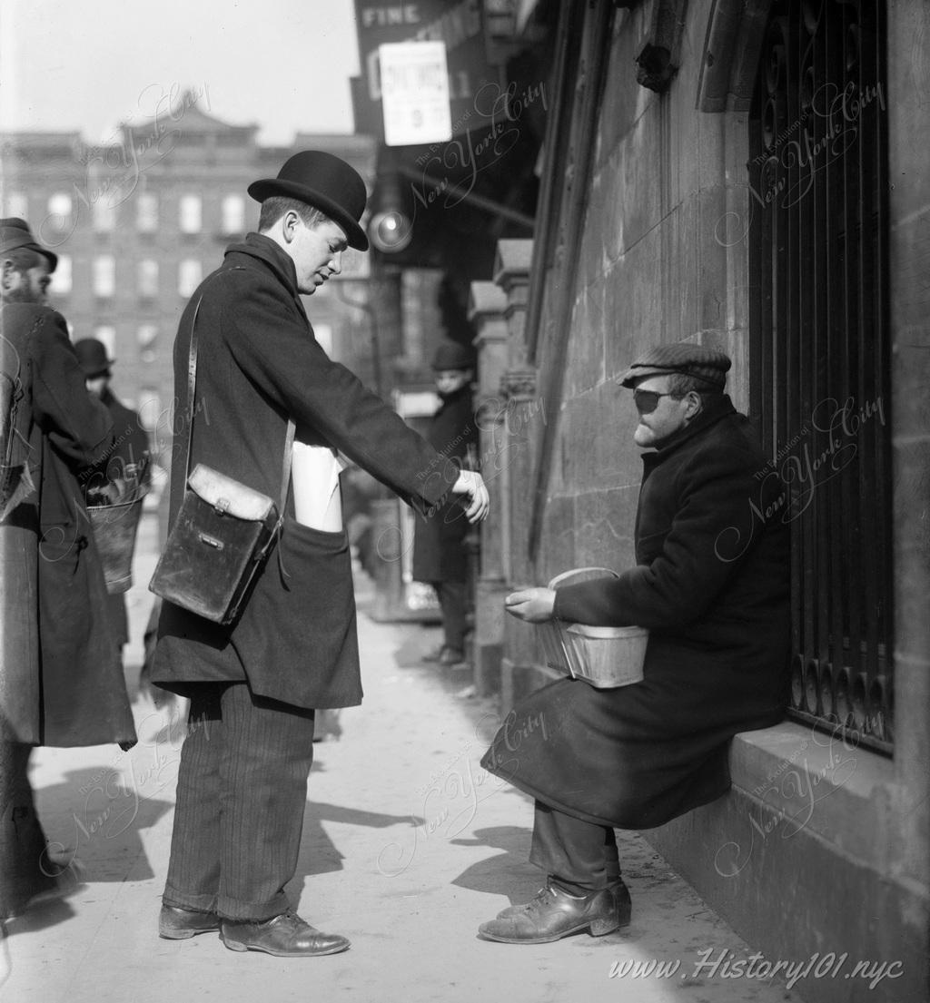 A man with an eyepatch and facial scars asking for spare change from a passing pedestrian.