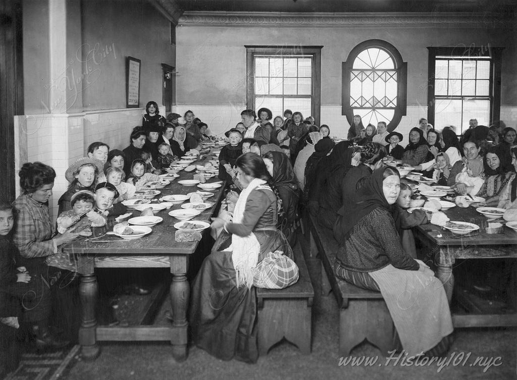 The facility at Ellis Island was equipped with a dining hall which was often used to provide free food for weary travelers after their long voyage.