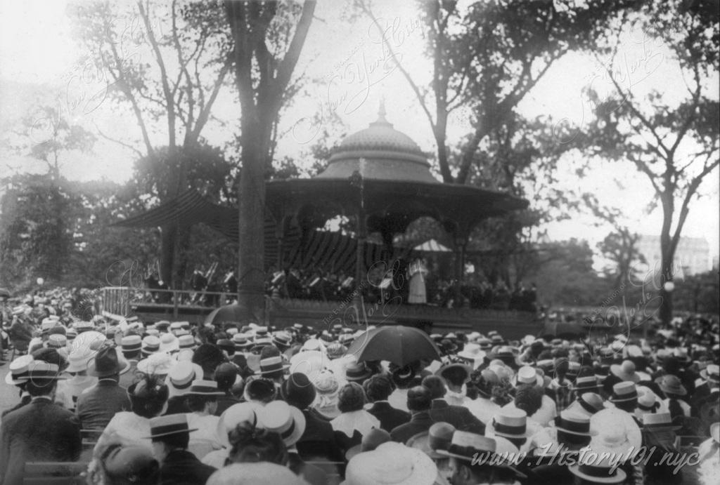 Spectators enjoy a musical performance at one of Central Park's pavilions.