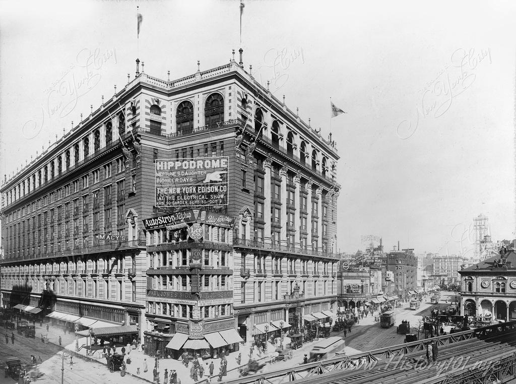 Shoppers and commuters fill Herald Square in front of Macy's famous department store.