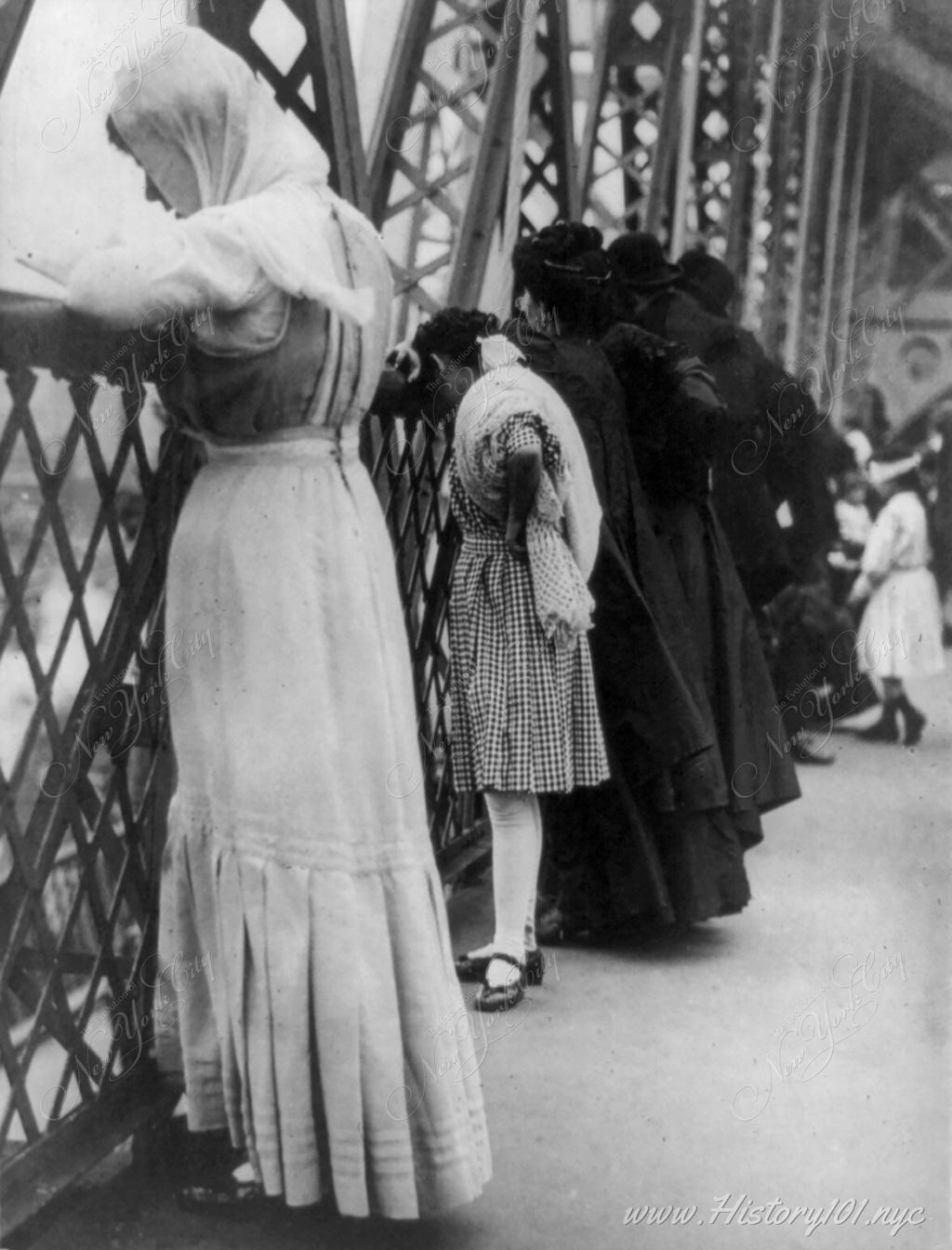 A group of Jewish citizens recite prayers on the pedestrian path of the Williamsburg Bridge for the Jewish New Year.