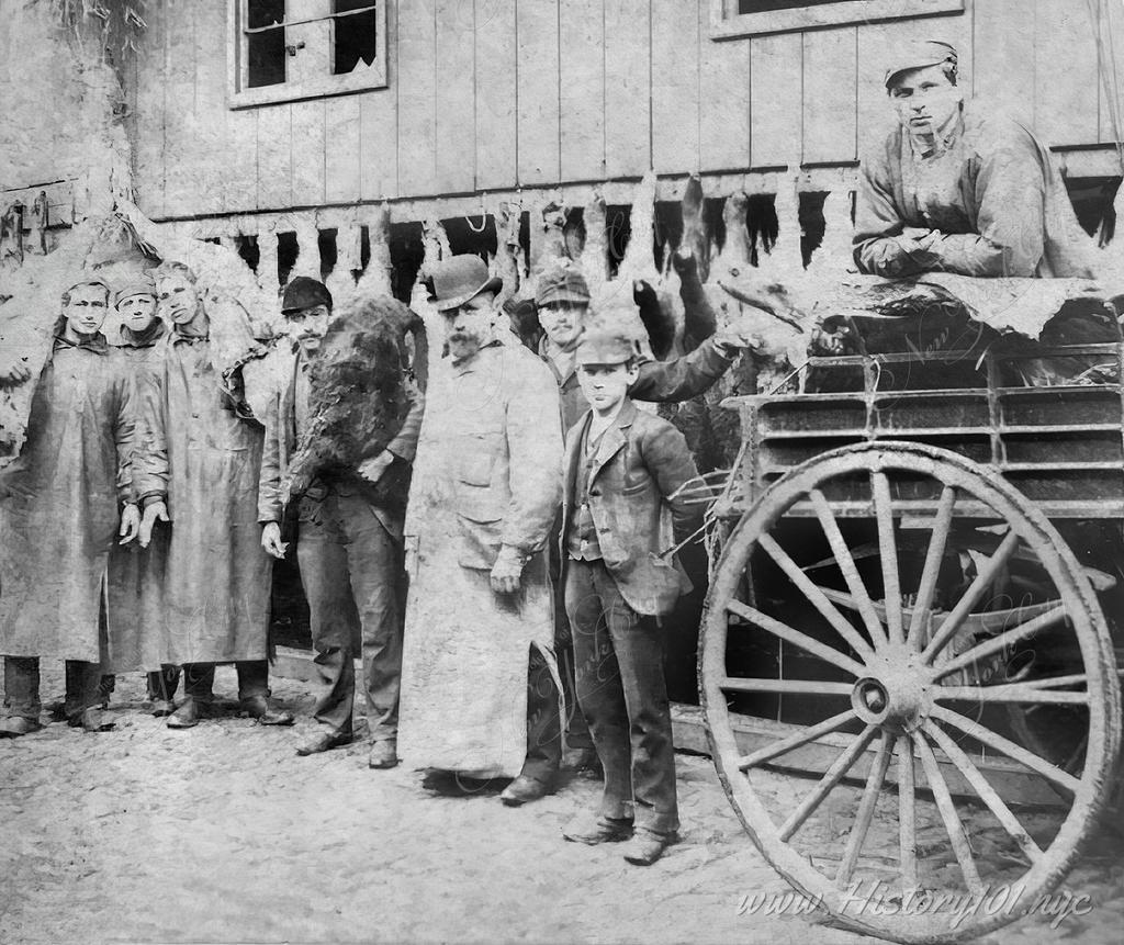 A group of butchers pose together in front of their shop in what is known today as Tribeca.