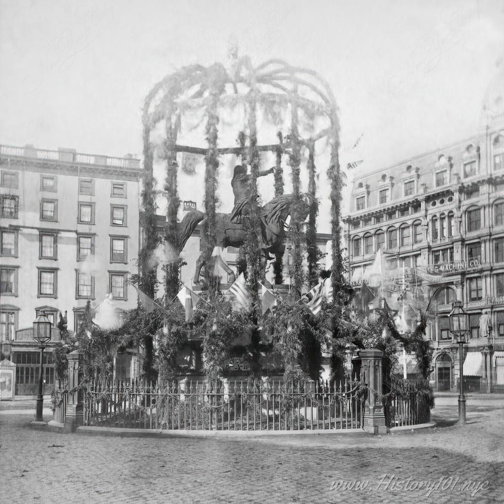 Washington Statue at Union Square, decorated with foliage and flags for Decoration Day.