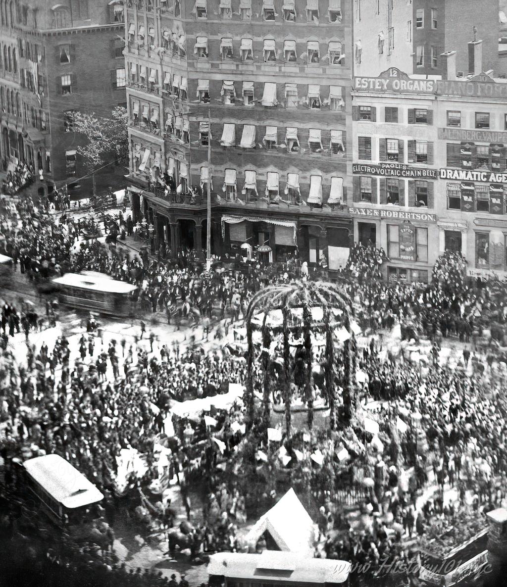 An elevated perspective of the Washington Statue at Union Square, surrounded by crowds of people and decorated for Decoration Day.