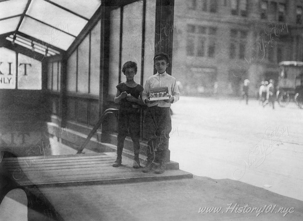 Young folk selling gum at the exit from the downtown side of the Lexington Avenue subway station