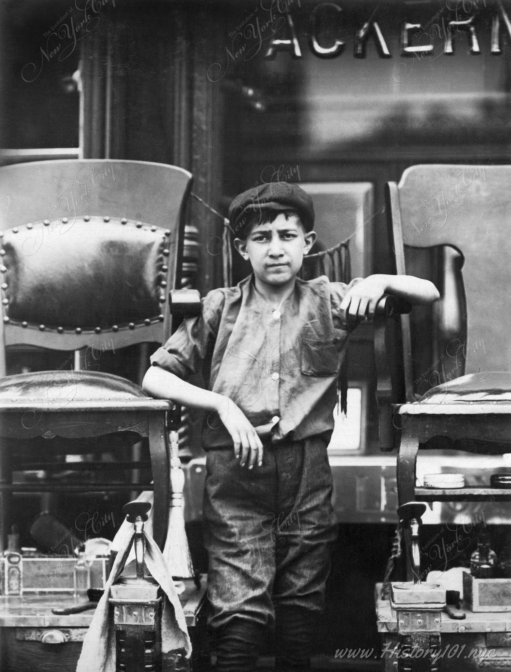 Photograph of a Frank Villanello, tending his father's shoe shine stand located at 21 Greenwich Avenue