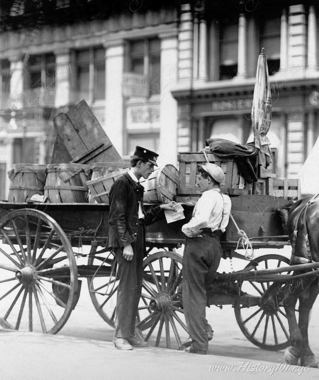 Two young messenger boys converse in front of a carriage near Union Square. Most of the messengers worked for telegraph companies or pharmacies.