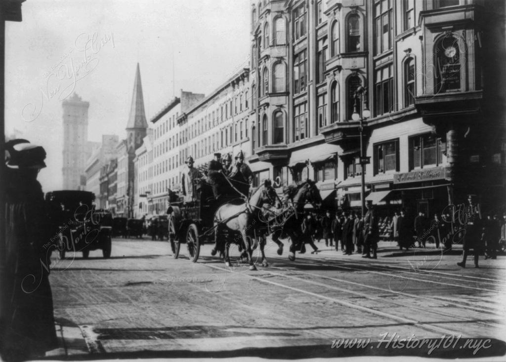 Photograph of firemen on their way to the tragic Triangle Shirtwaist Company fire in Greenwich Village.