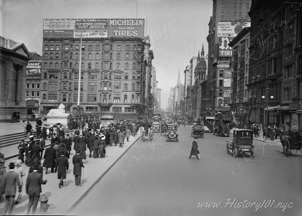 Photo shows Fifth Avenue on Easter day, March 23, 1913. New York Public Library on left and spires of St. Patrick's Cathedral in distance. 