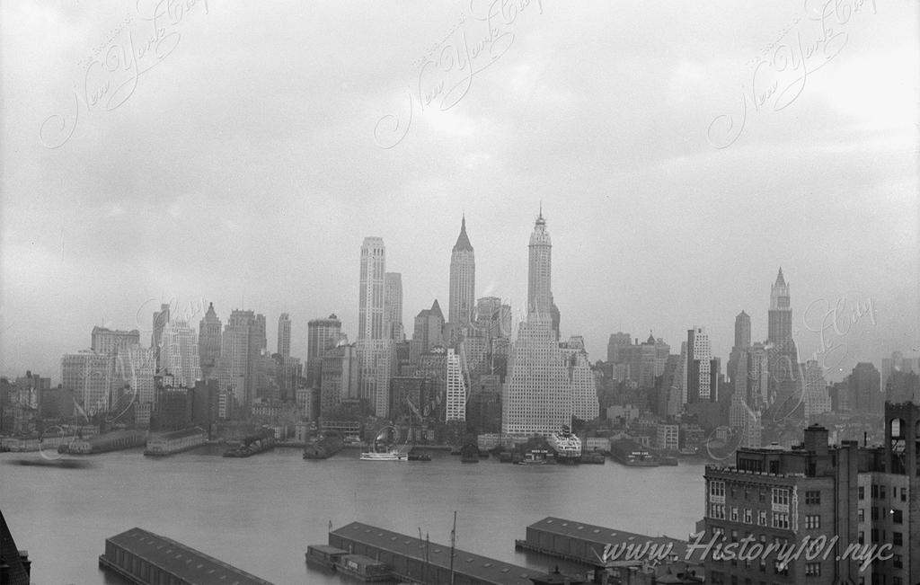 Photograph of the East River and Manhattan's famous downtown skyline taken from Brooklyn.