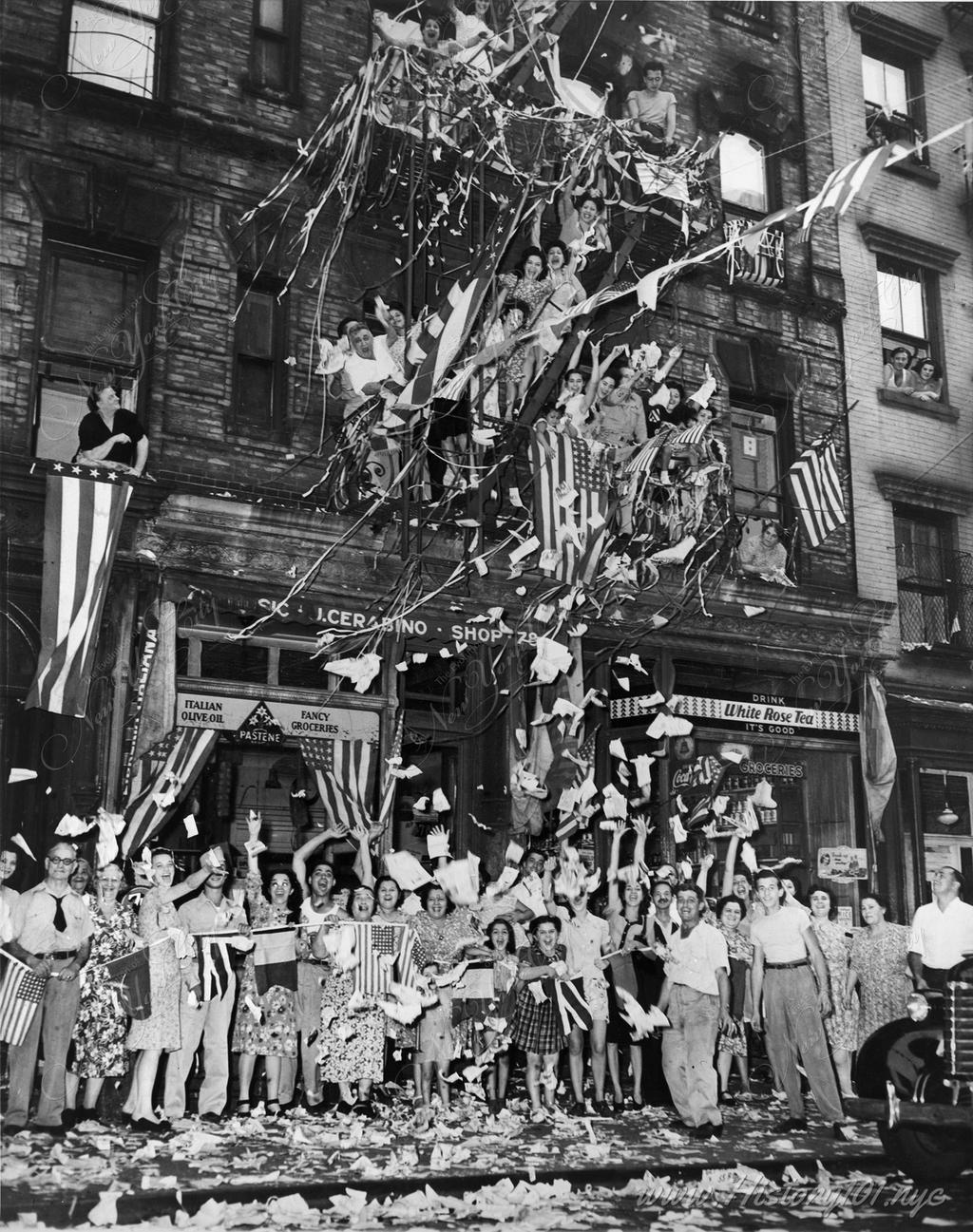 Residents of New York's "Little Italy" in front of 76 Mulberry Street greet the news of Japan's acceptance of Allied surrende.