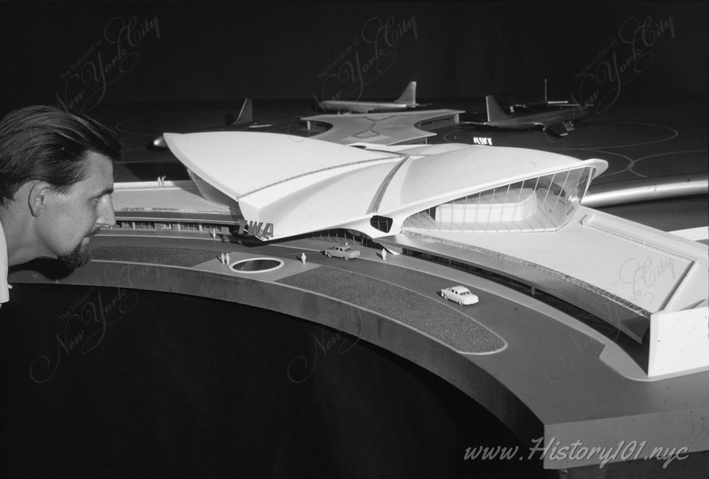 Photograph of architect Balthazar Korab with a scale model of his proposed design for the Trans World Airlines Terminal and John F. Kennedy Airport in Queens.