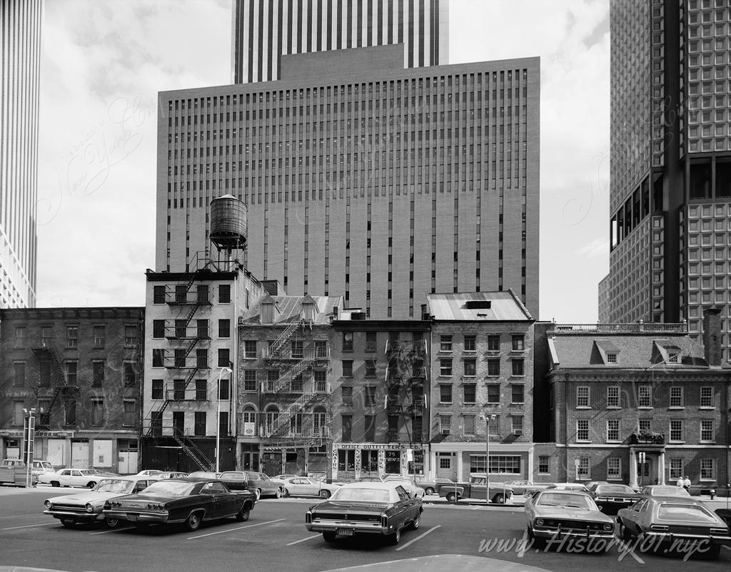 Cars parked in front of Fraunces Tavern Block, Bounded by Pearl, Water & Broad Streets & Coenties Slip.