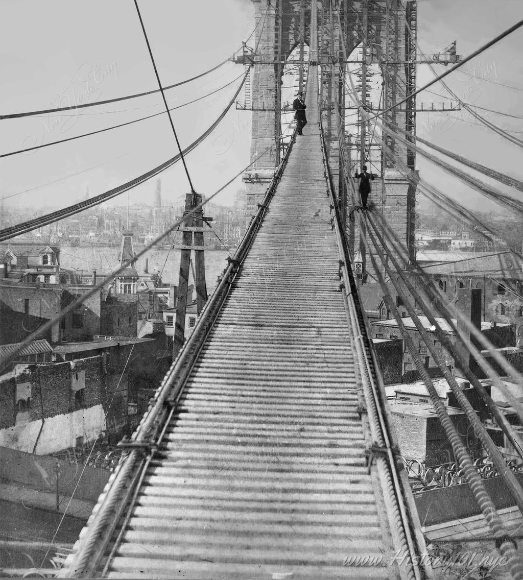 Photograph show men on the scaffolds during the construction of what was known at the time as the Great East River Bridge.