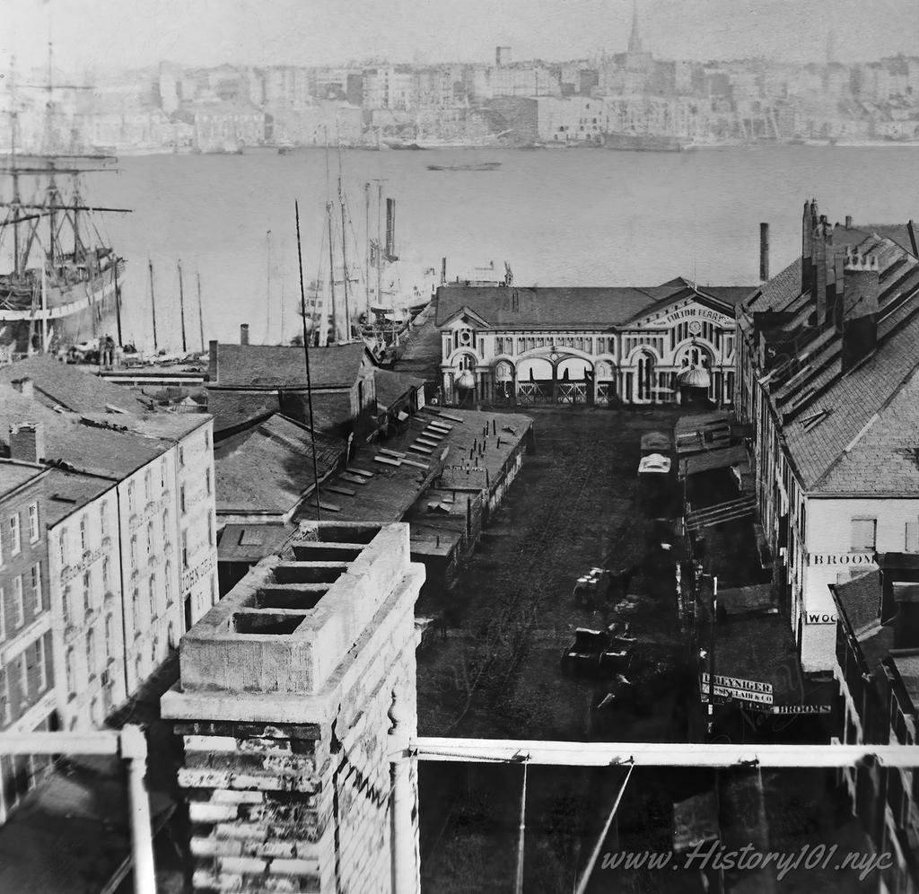 View south looking down Fulton Street at pier 17 and the north elevation of the Fulton Ferry Terminal at South Street Seaport, Piers 17 & 18, South Street.