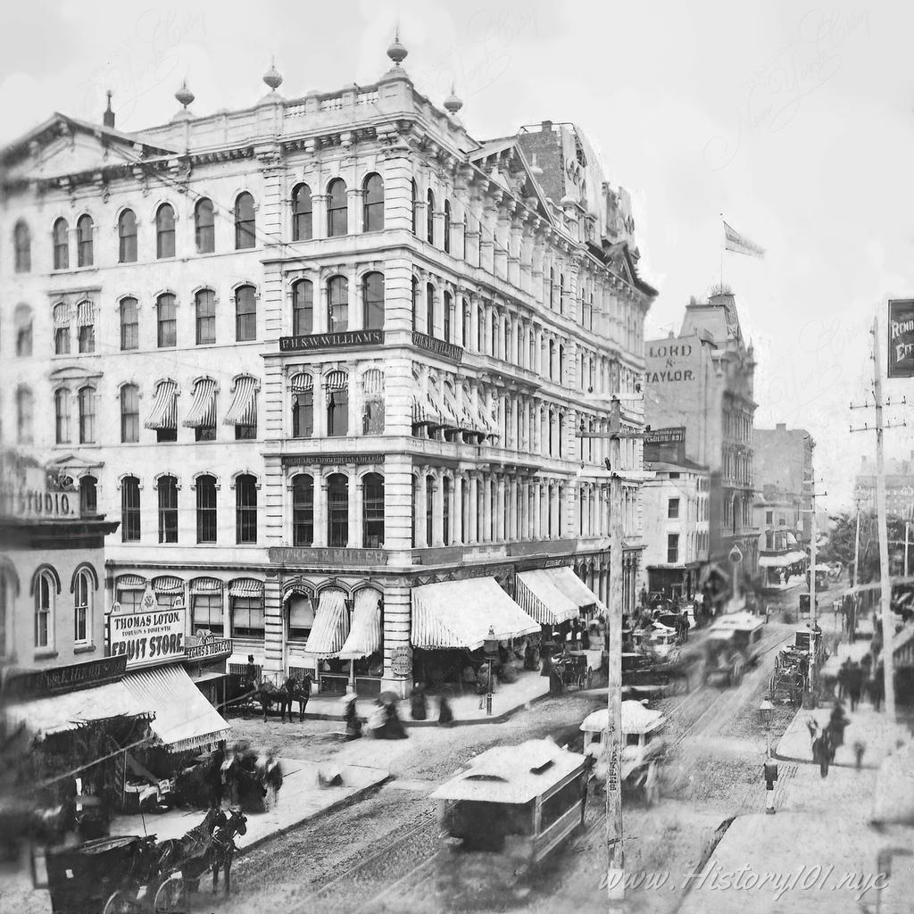A slightly elevated perspective of a bustling street known as Broadway, which remains a hub of commerce and culture to this day.