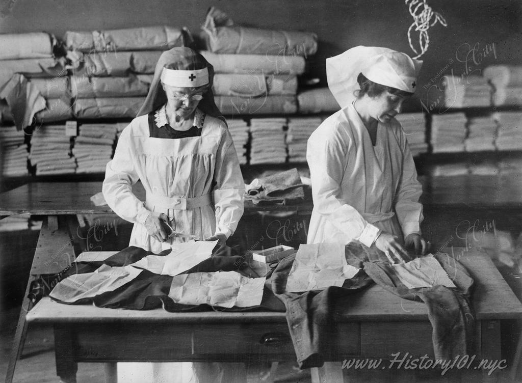 Photograph of workers in the NYC Chapter Red Cross turning old clothes into warm, substantial garments for the needy children of central Europe.