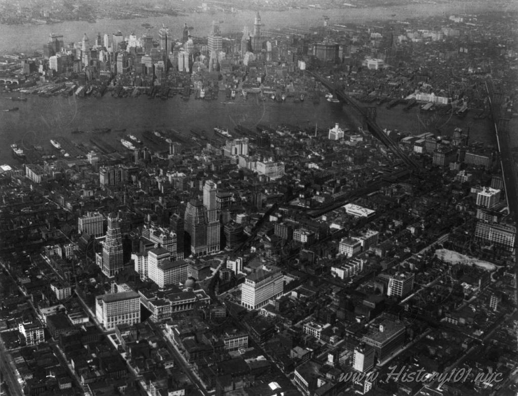 A bird's eye perspective of Brooklyn and Downtown Manhattan and both East River Bridges.