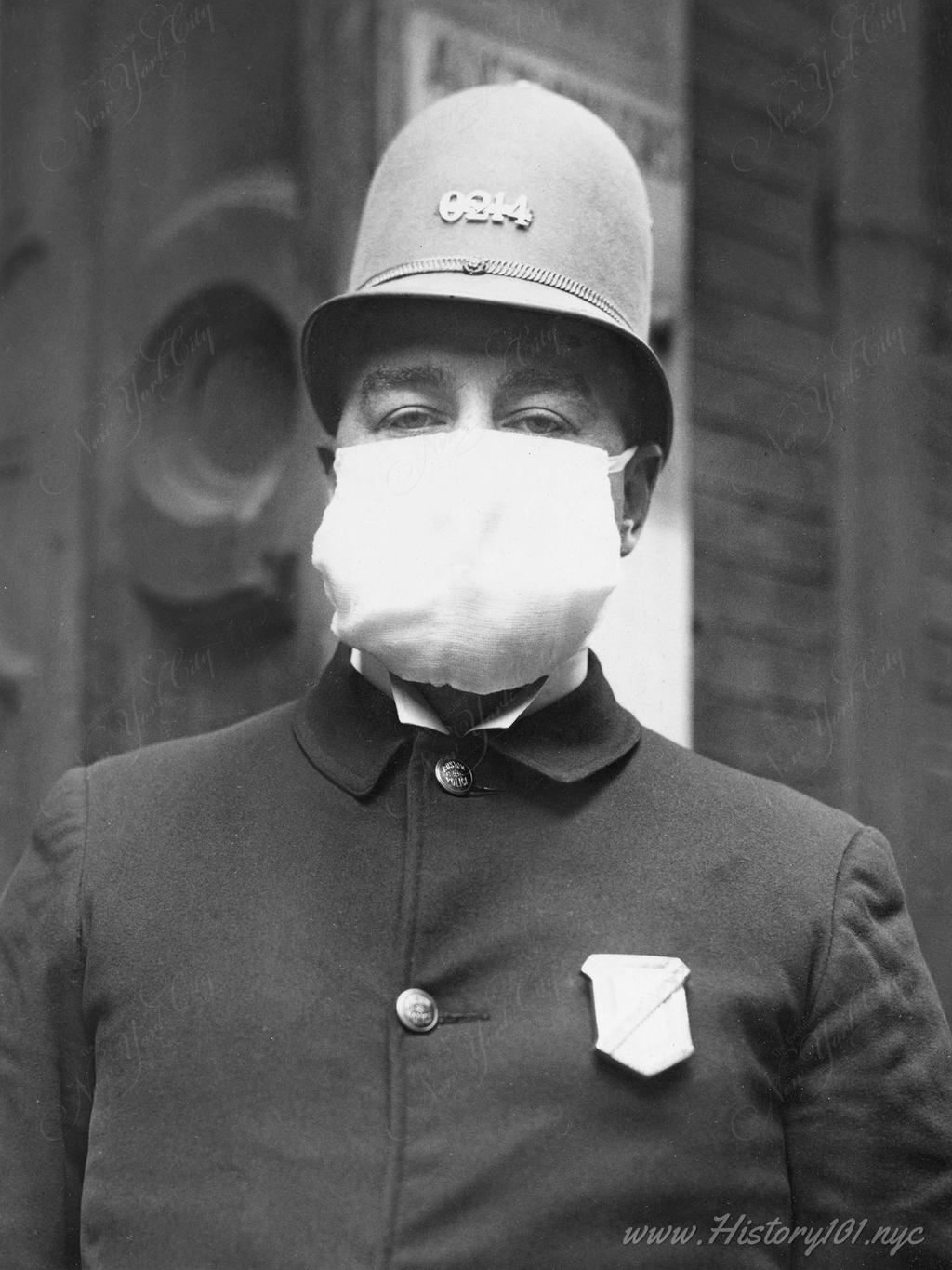 Photograph of a policeman wearing a mask during the Spanish Flu pandemic. 1700 of these masks were distributed to police throughout the city for protection.