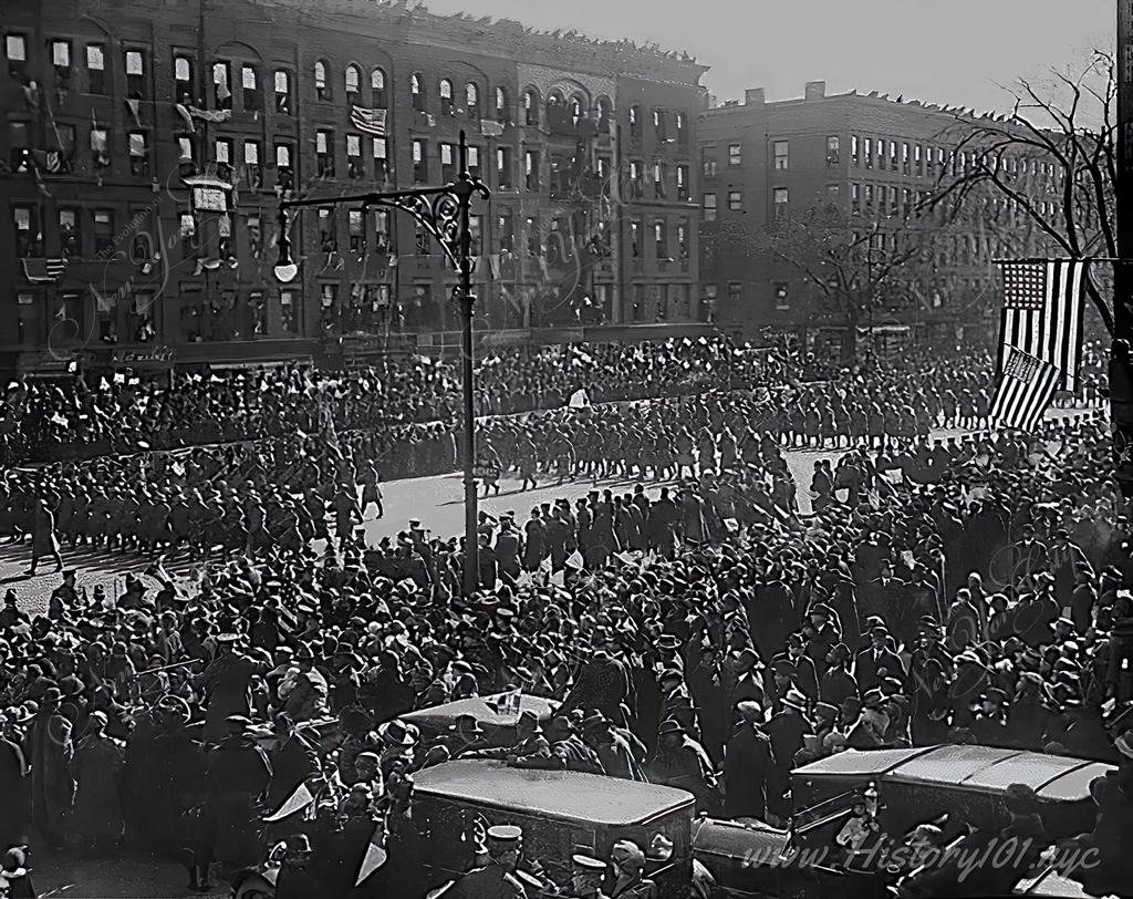 Photograph of a parade held in honor of the 369th Infantry upon their victorious return home.