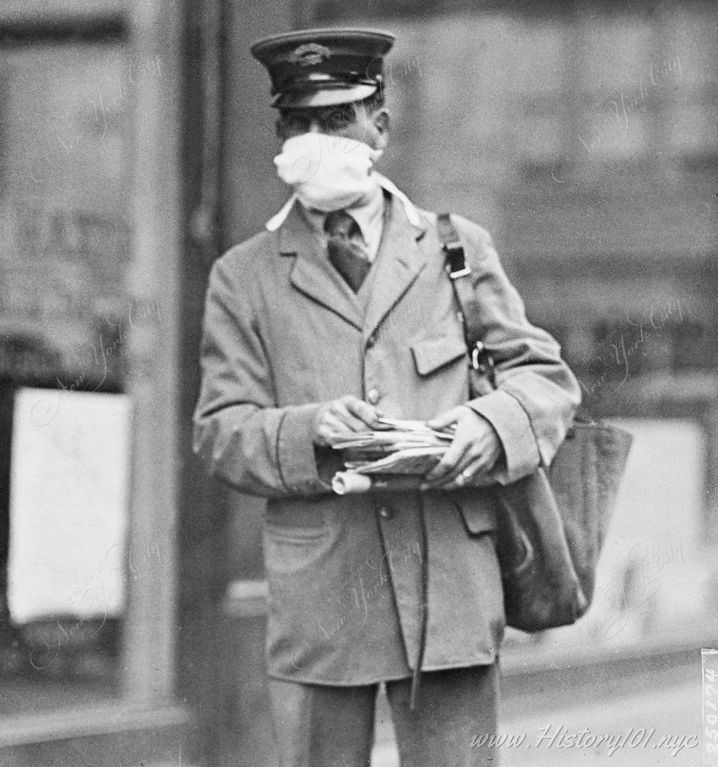 Photograph of a mailman wearing a face mask during the deadly avian flu which was sweeping the world.