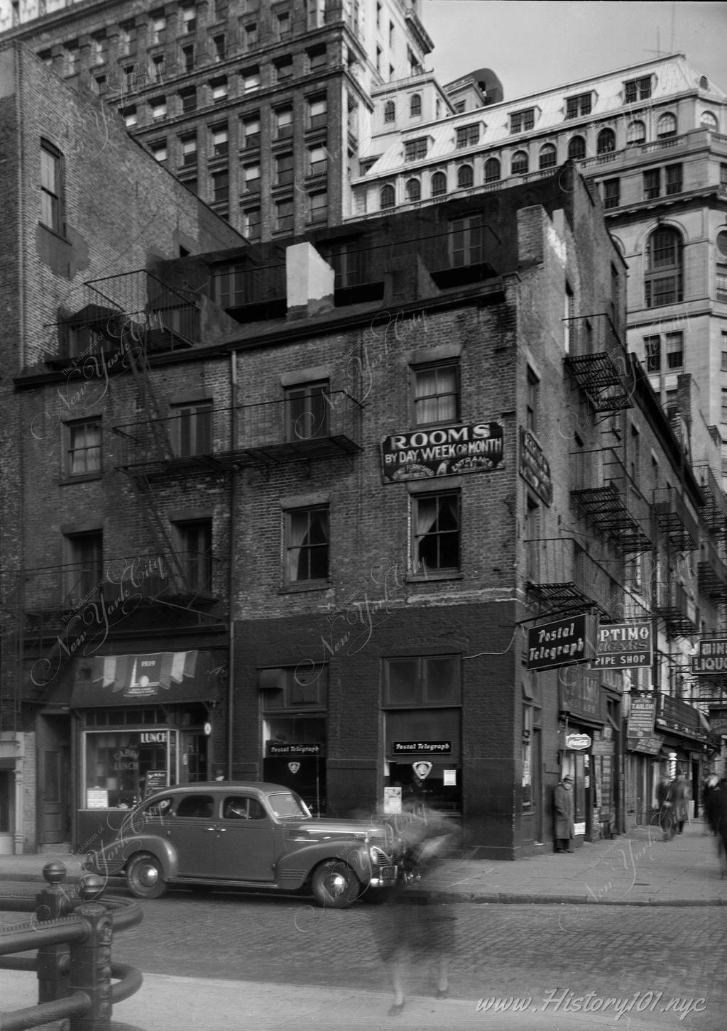 Exterior view of old buildings at the corner of Battery Place and Washington Street from southwest.