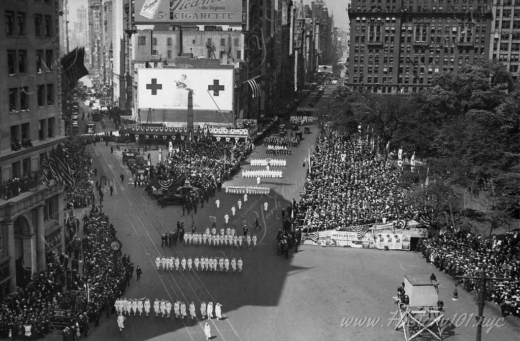 Photograph of the Red Cross Parade being reviewed by President Wilson at junction of Broadway and Fifth Avenue.