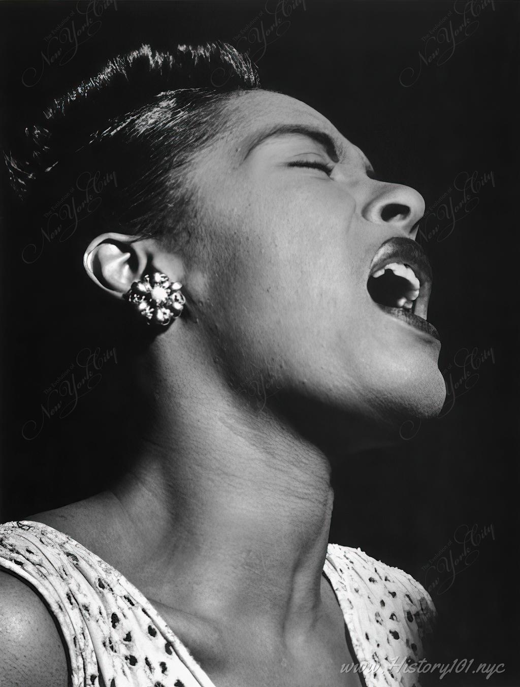 Close up photographic portrait of Billie Holiday singing at Downbeat Jazz Club.