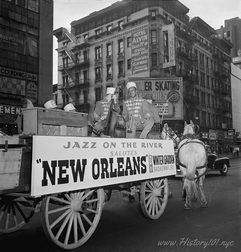 Photograph of jazz musicians Art Hodes, Kaiser Marshall, Henry (Clay) Goodwin, Sandy Williams, and Cecil (Xavier) Scott at Times Square.