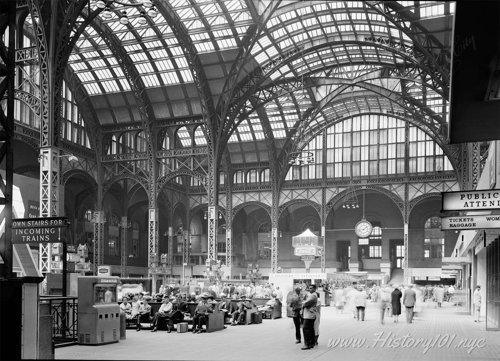 Photograph of passengers waiting for their train at  Pennsylvania Station's Main Concourse.