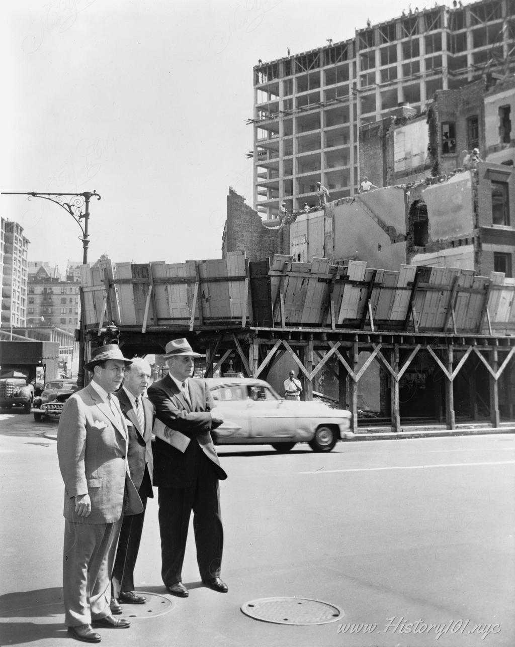 Photograph of Mayor Robert Wagner joined by Robert Moses and Frank Meistrell on a housing project tour.