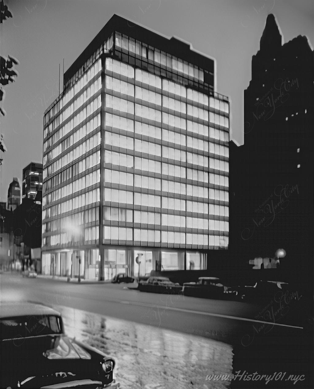Photograph of the Girl Scout Building at 3rd Avenue and 51st Street, taken at night.
