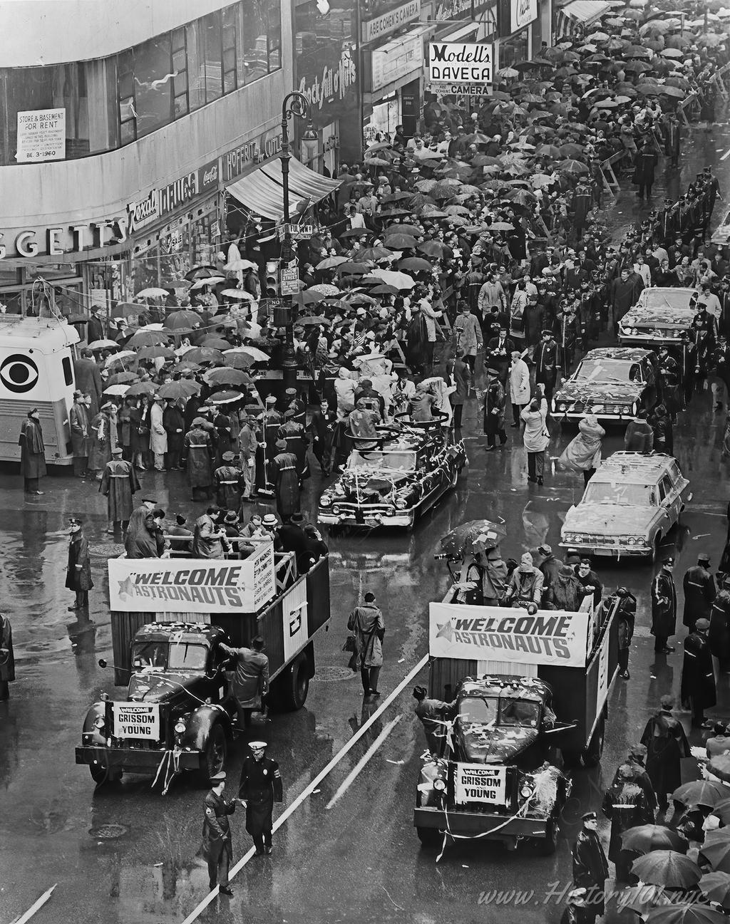 Aerial photograph of a ticker tape parade for astronauts Virgil Grissom and John Young (seated in last car with Vice President Humphrey).