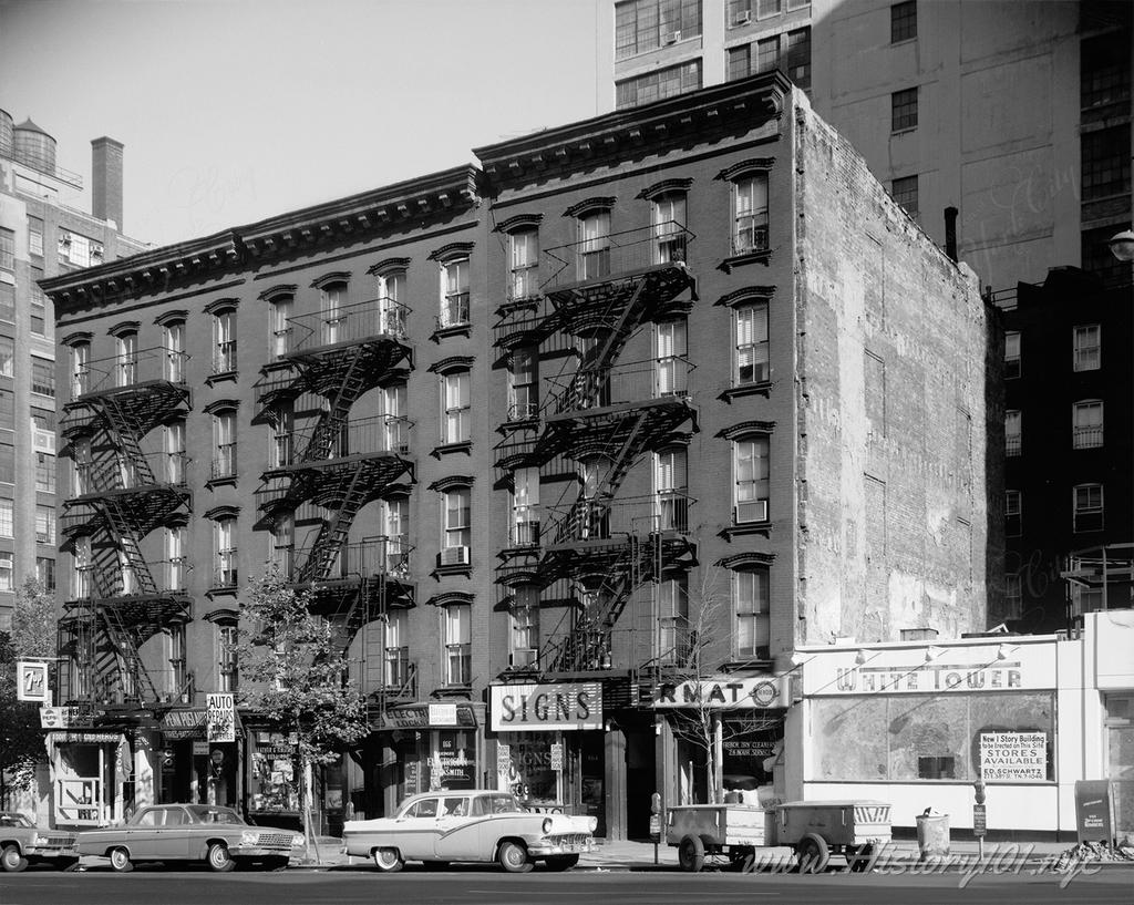 Photograph of classic cars parked in front of apartment buildings on Second Avenue, near the United Nations.