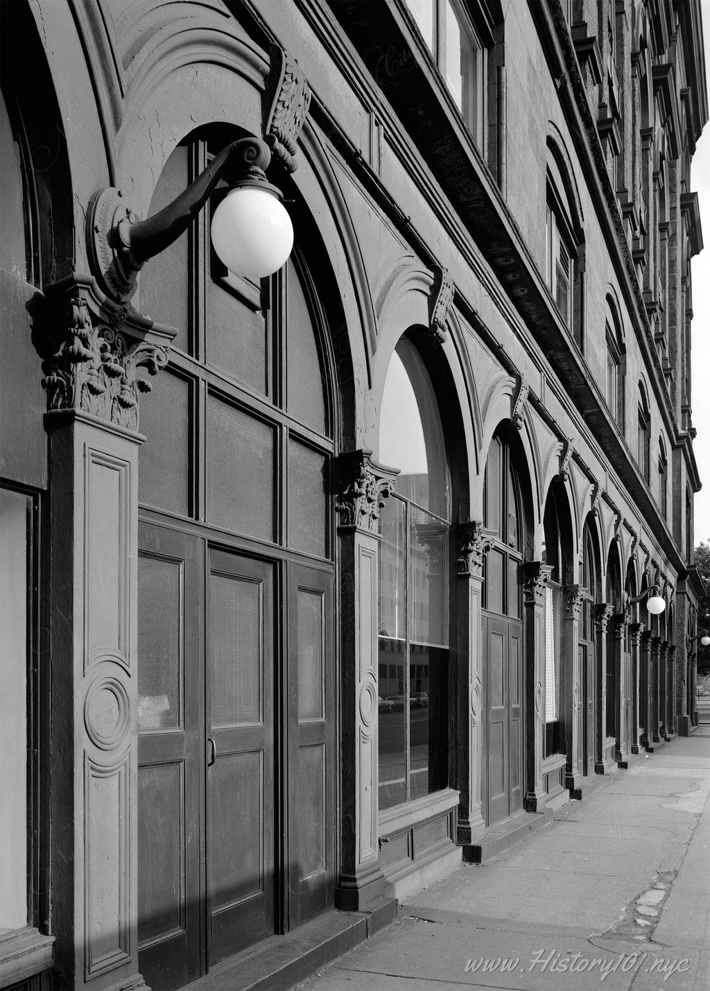 Photograph of Cooper Union's carved stone facade, showing off the building's architectural details.