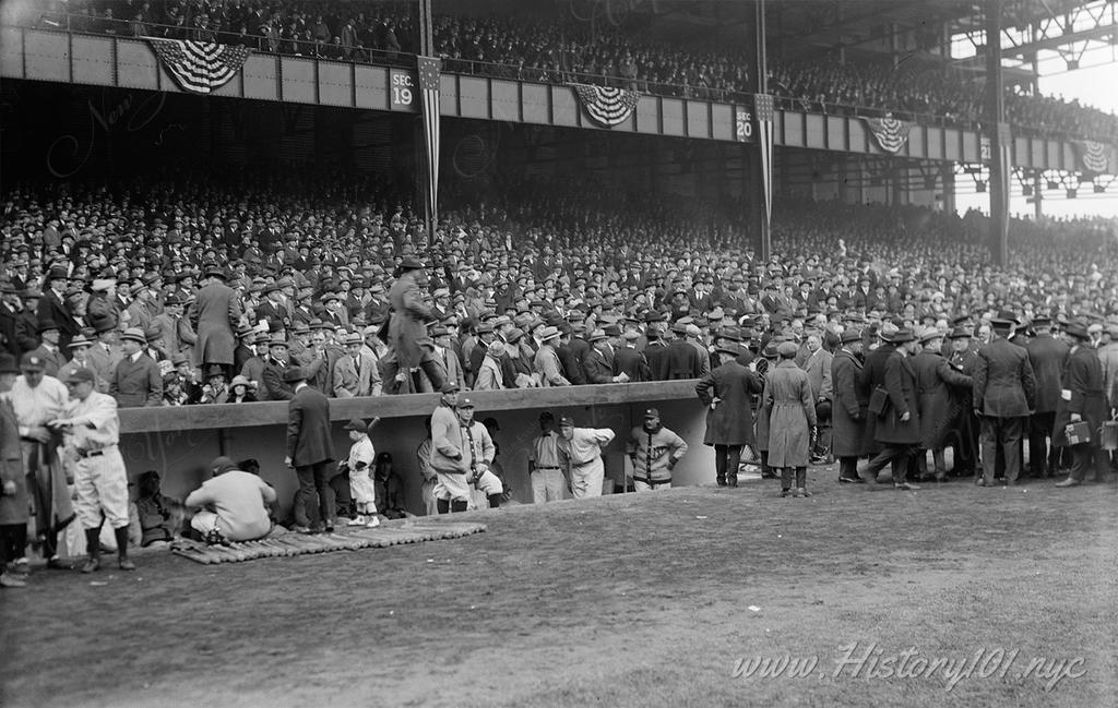 Photograpg of the packed stands behind the dug out at Yankee Stadium on opening day.