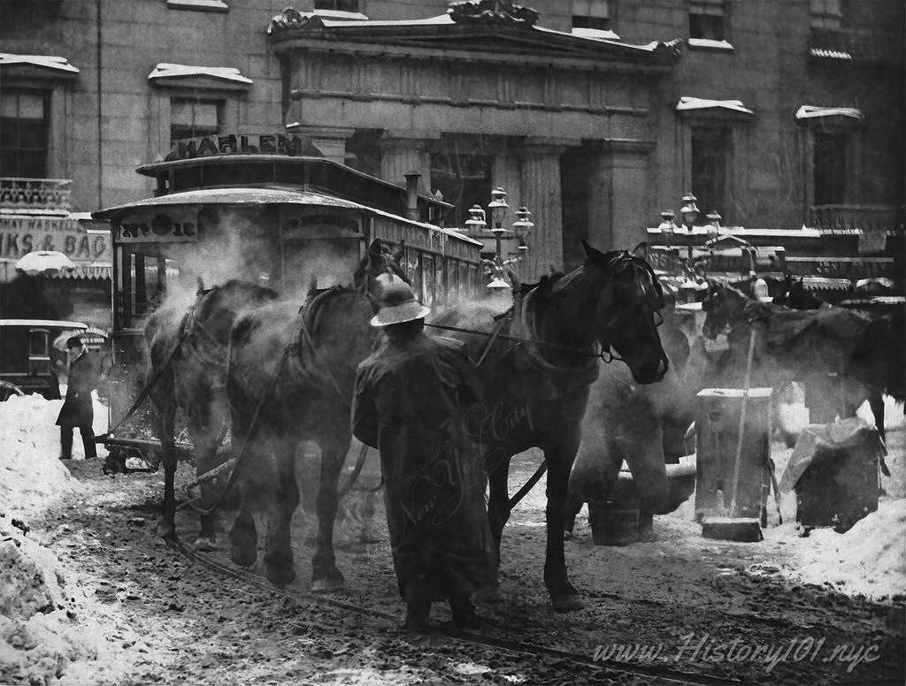 Photograph of a horse drawn trolley in front of the Astor House Hotel.