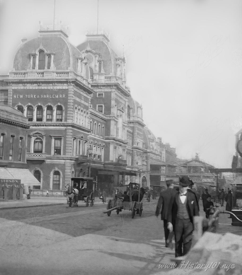 Photograph of a street scene in front of Grand Central Depot, at the time the largest interior space in the nation.