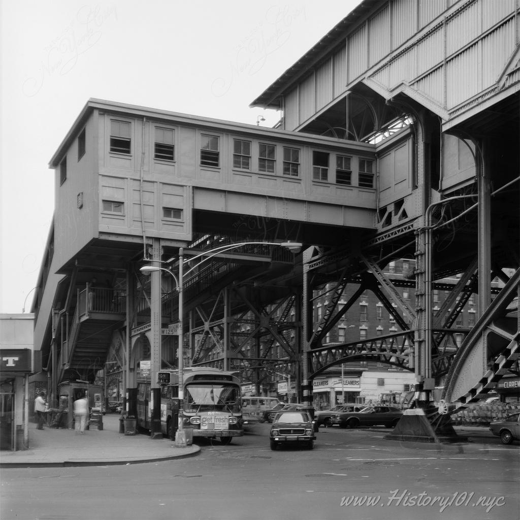 Photograph of Manhattan Valley Viaduct station's east stairway and platform showing a new escalator built over the stairs.