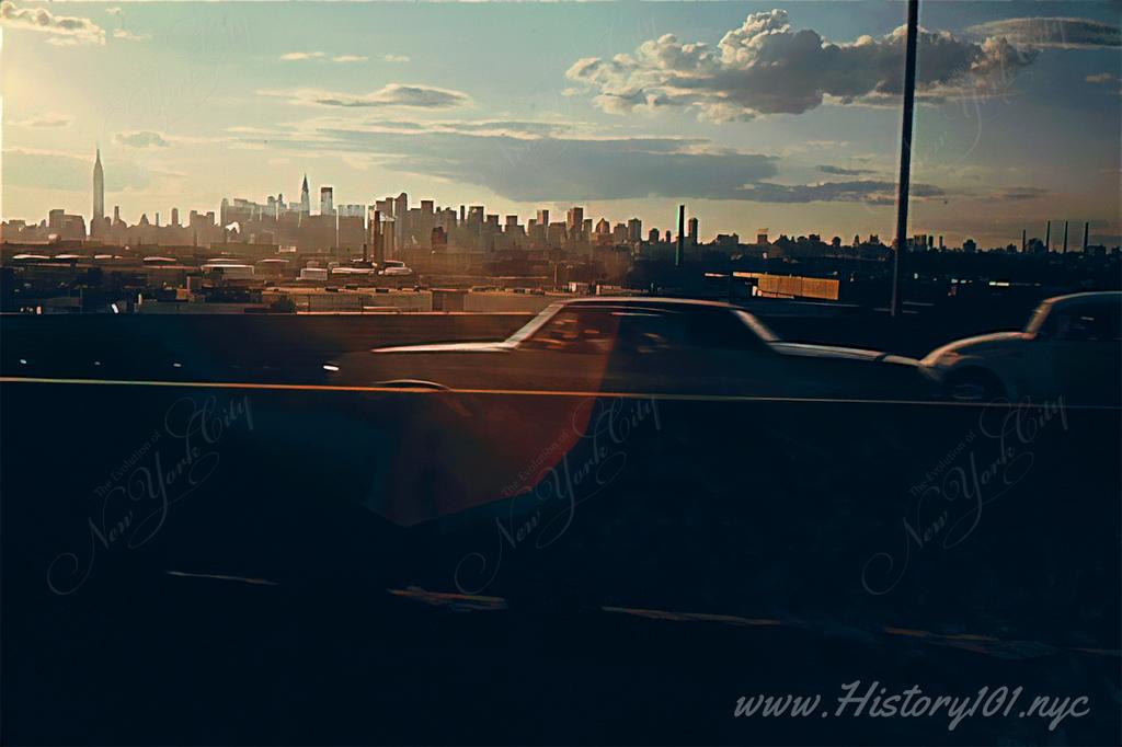 Photograph of a sun-drenched Manhattan skyline, taken from the Brooklyn Queens Expressway.