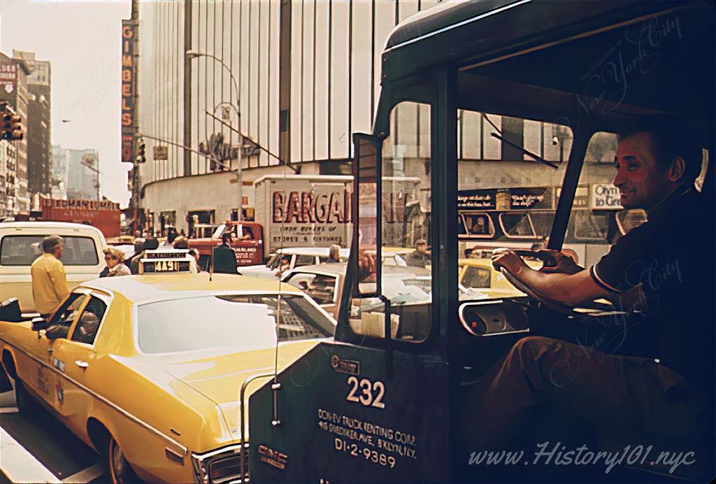 A truck driver sits through a traffic Jam in Herald Square.