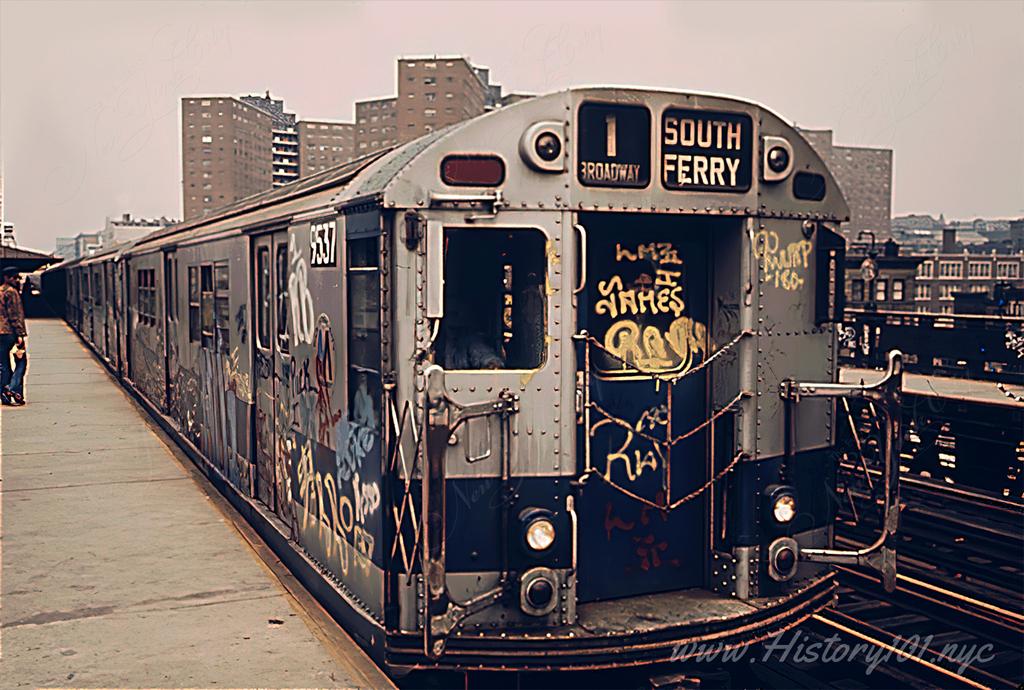 Photograph of a graffiti covered 1 Train at the 125th Street Station on its way to South Ferry.