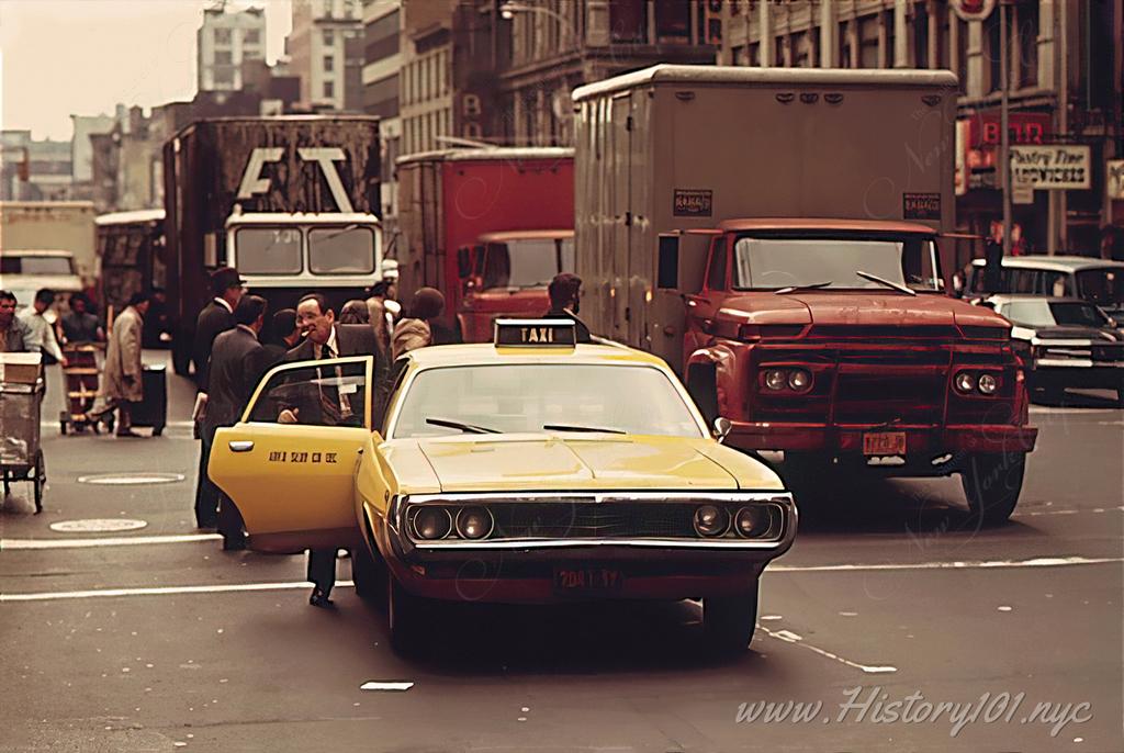 Photograph of a Manhattan taxi driver picking up a fare. By 1973 the city had over 1,700 active cabs.