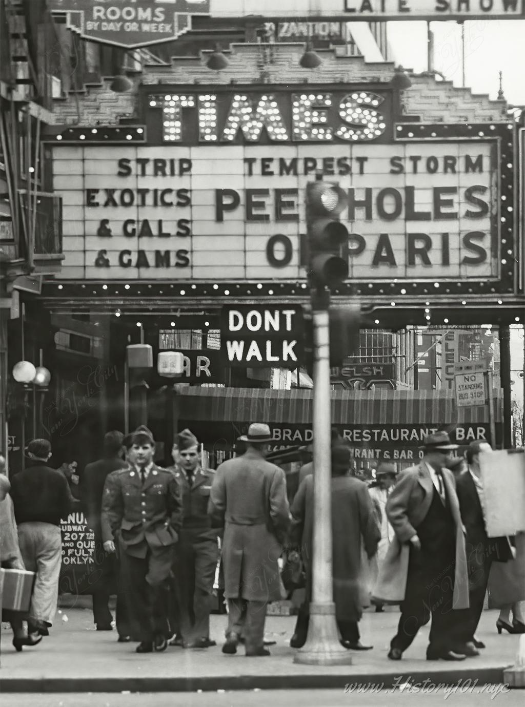 Photograph of Marquee in Times Square - The neighborhood would become renowned for go-go bars and peep show establishments.