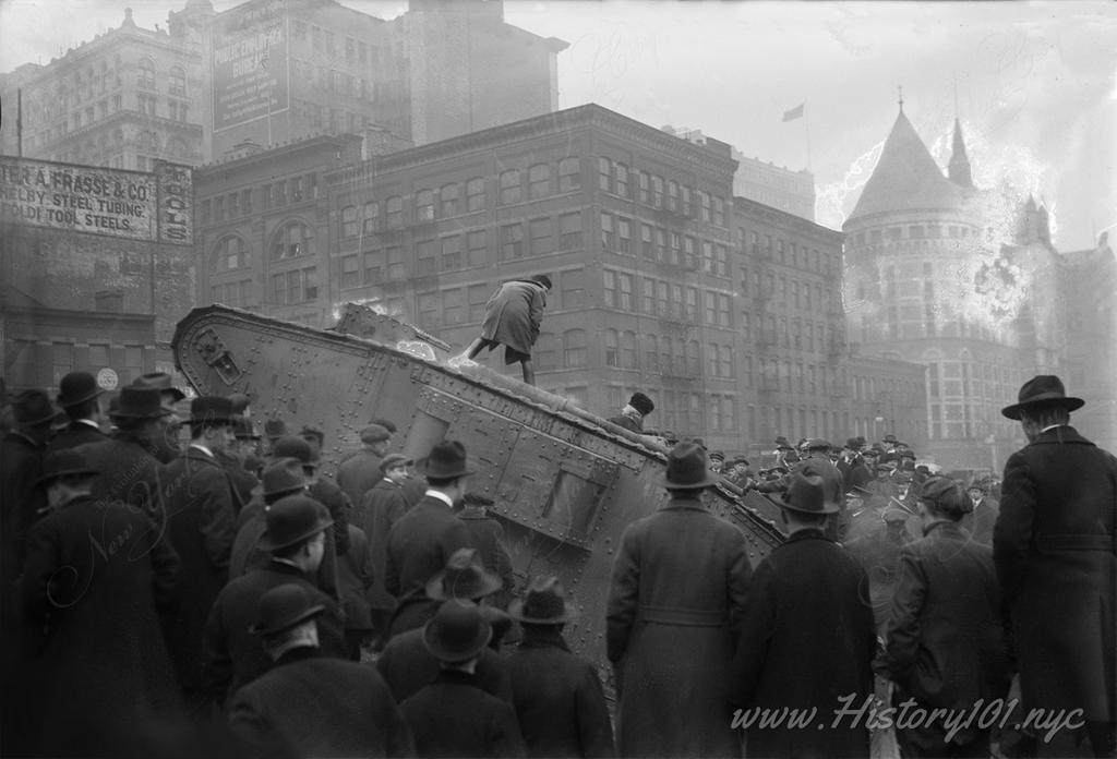 Photograph shows the British tank Britannia at the construction site of the courthouse behind the Municipal Building.