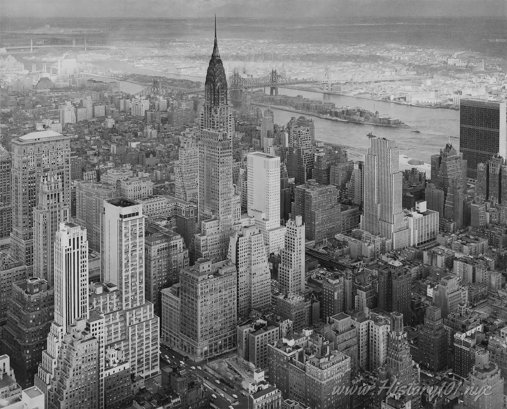 Aerial photograph of Manhattan including the Chrysler Building and other midtown skyscrapers.