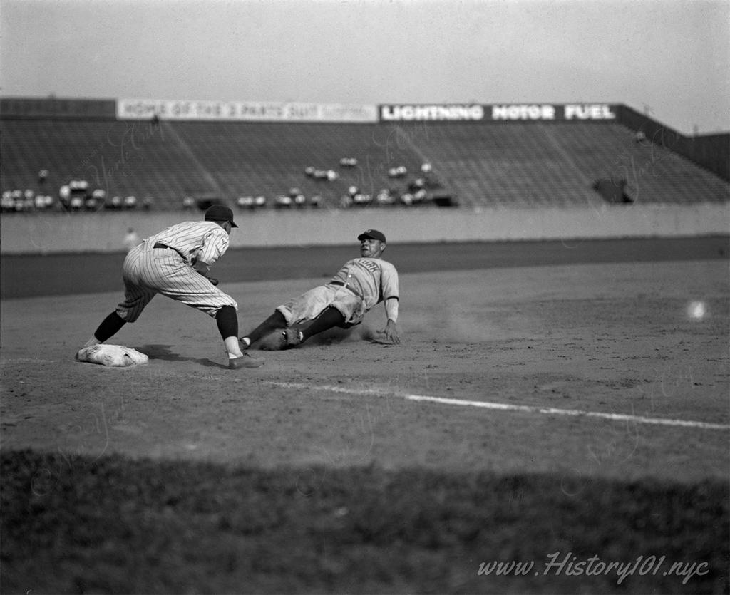 Photograph of Babe Ruth out in fifth inning trying to go from first to third on Lou Gehrig's single, facing off against Senators third baseman Ossie Bluege.
